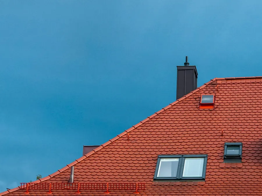 Red clay tile roof with a skylight