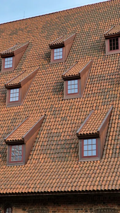 Terracotta tile roof with dormer windows