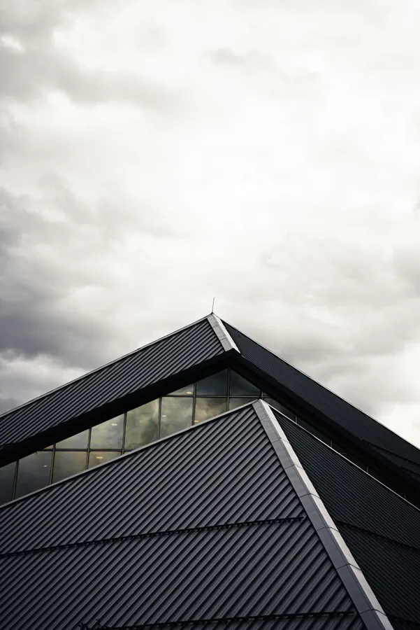 Modern dark roof with a glazed gable