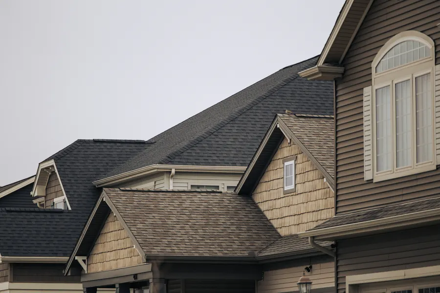Newly shingled roof with a dormer window