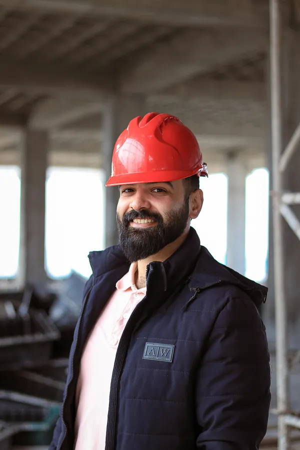 Roofing contractor in a hard hat on a job site