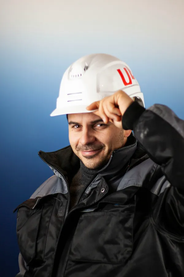 Roofing contractor tipping his hard hat